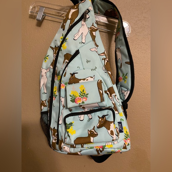 Ngil Handbags - Light Blue Goat Lamb Flowers Print Sling Backpack
